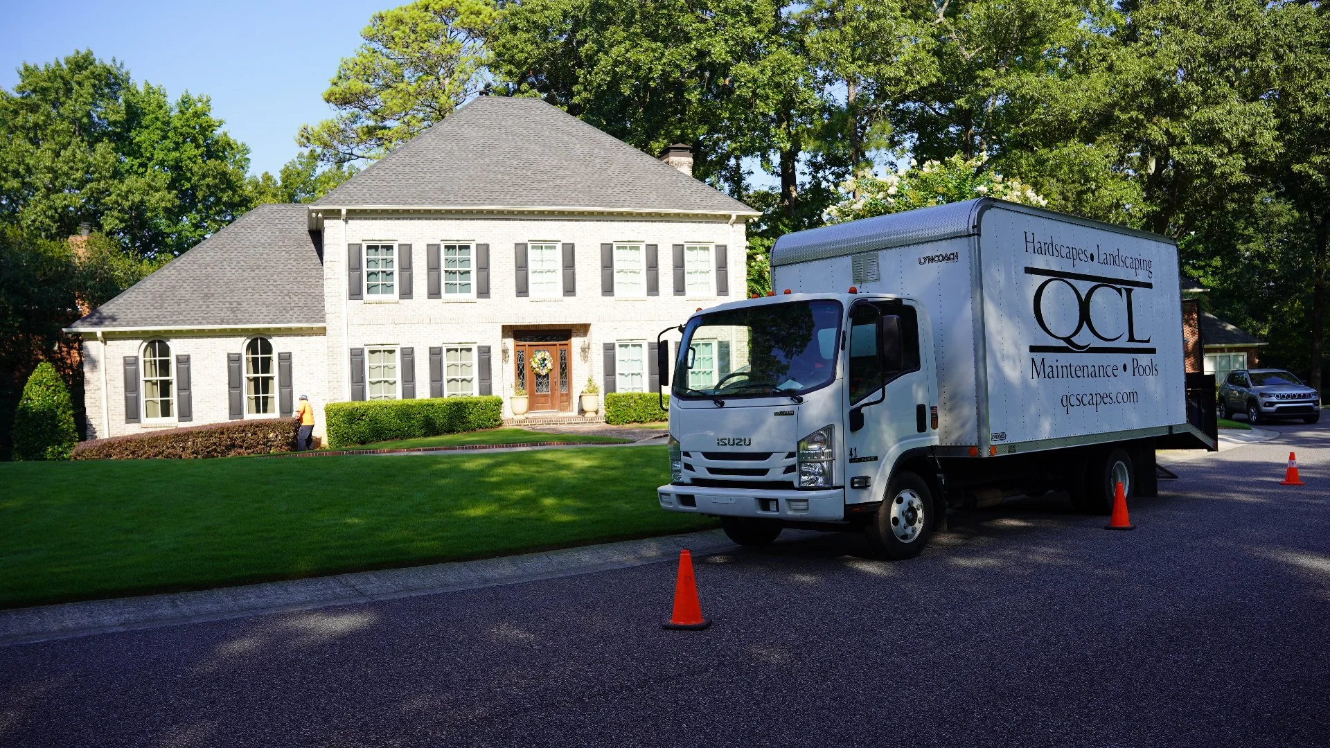 Quality Creative Landscaping truck and crew at customer's home in Greystone, AL.