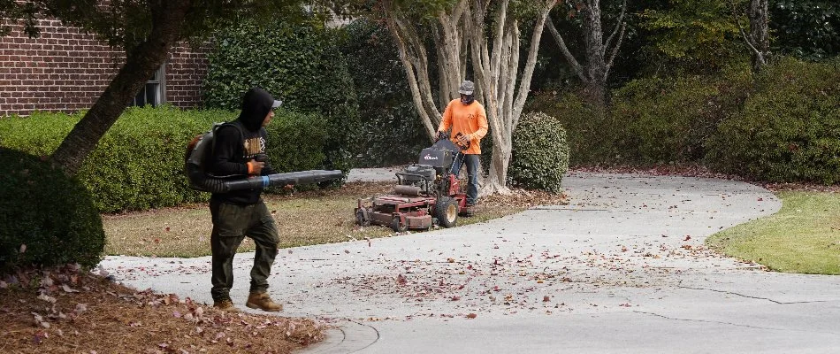 Men mowing the lawn and blowing leaves in Mountain Brook, AL.