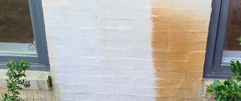 Peeling paint on a wall, revealing a discoloration pattern in Mountain Brook, AL.