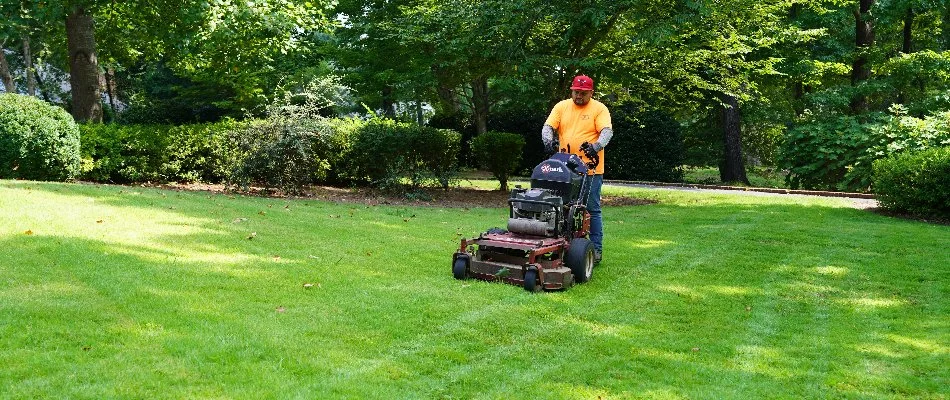Crew performing lawn mowing in Moores Mill, AL.
