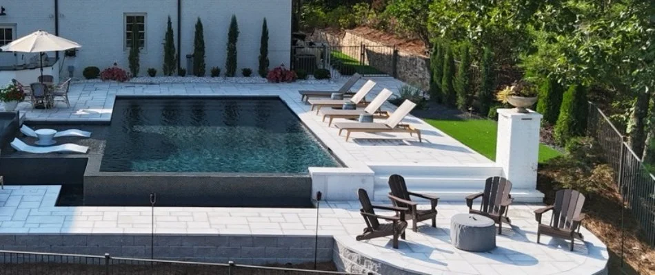 Fire pit in Hazel Green, AL, beside a pool.