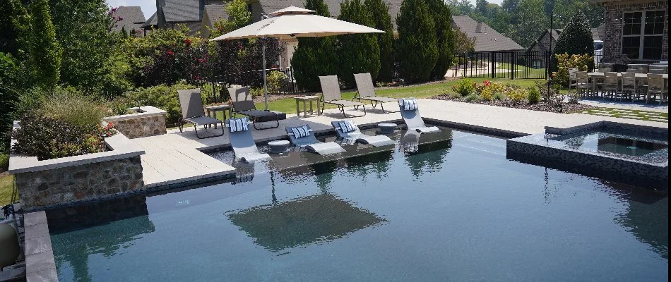 Pool with chairs and landscaping in Huntsville, AL.