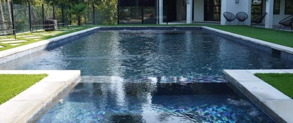 Pool in Mountain Brook, AL, surrounded by grass.