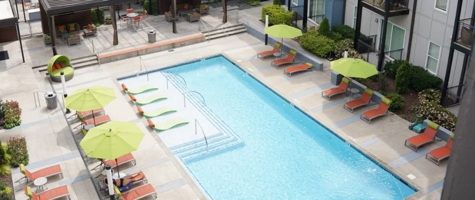 Pool in Meridianville, AL, with lounge chairs and umbrellas.